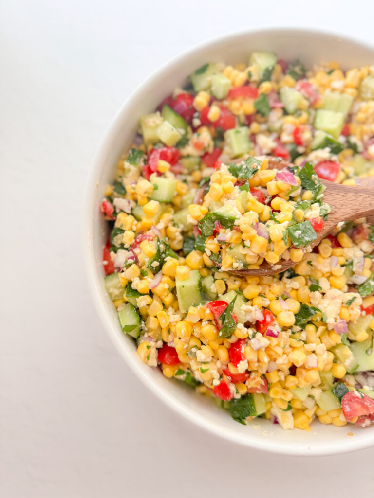 Easy corn salad with fetta, cucumber and tomatoes